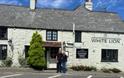 Managers of White Niton pub standing outside, Niton, Isle of Wight, eat & drink