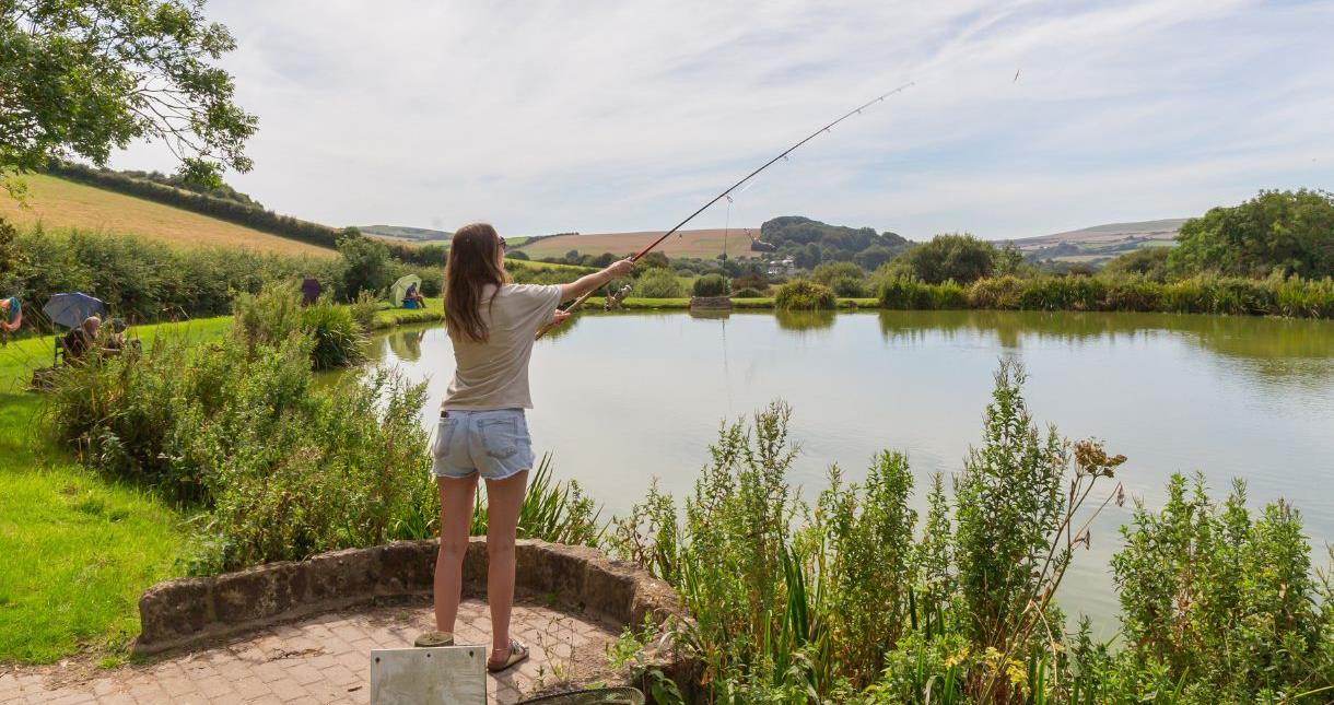 Lady fishing at Nettlecombe Farm, Isle of Wight