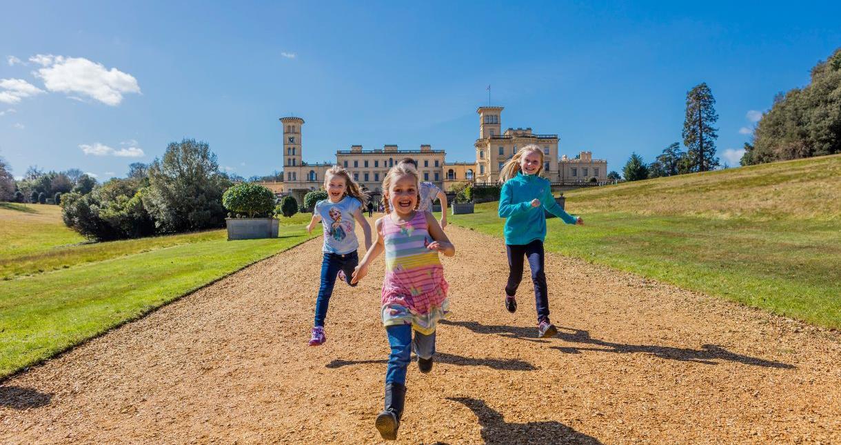 Children running within the grounds of Osborne House on the Isle of Wight