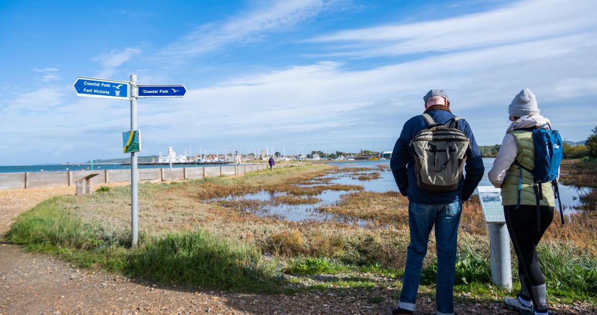 Couple walking along the coastal path at Yarmouth