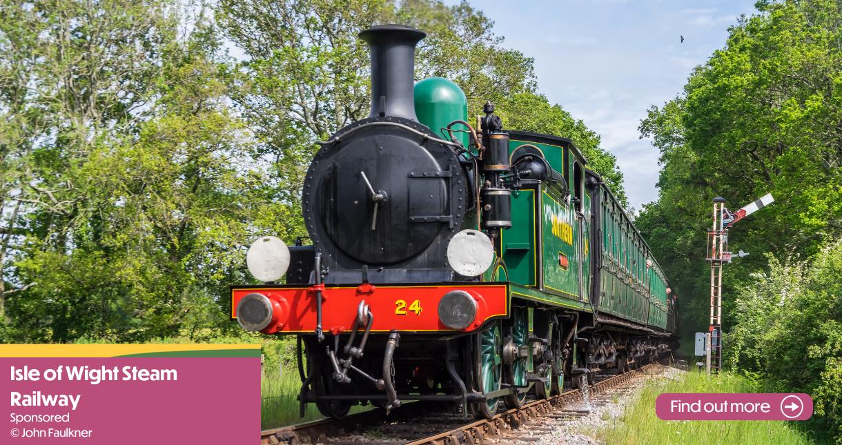 Steam train riding along the tracks at the Isle of Wight Steam Railway - image credit: John Faulkner