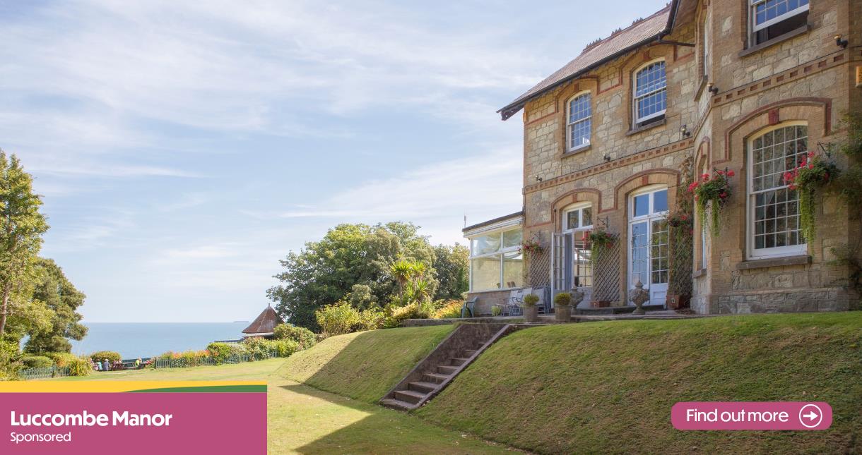 Outside view of Luccombe Manor and gardens with sea view