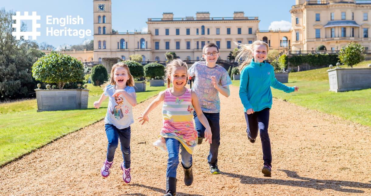 Children running in the grounds with Osborne House in the background
