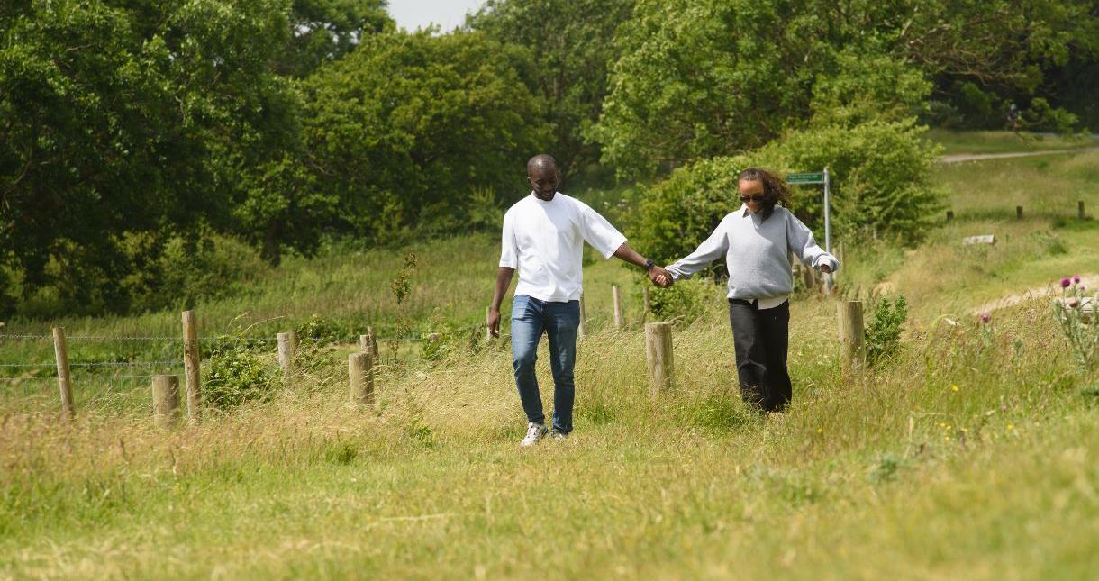 Couple walking in the countryside on the Isle of Wight