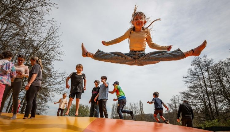 Girl bouncing on the pillow at Robin Hill Adventure Park, Newport, Isle of Wight, attraction, family, children activities
