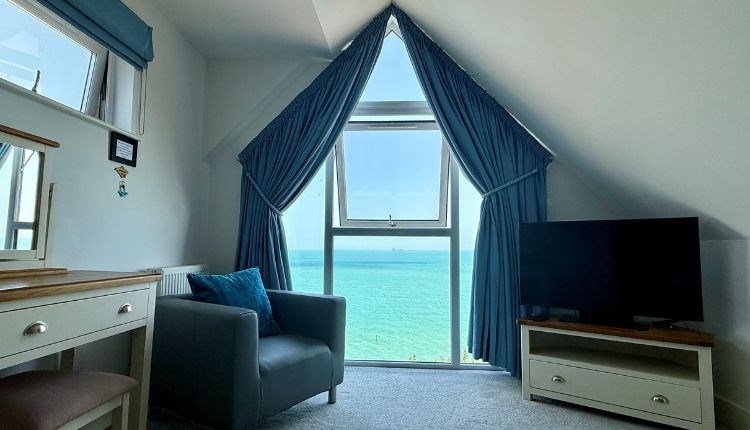 Master bedroom with sea views in BayVue Apartment, The Bay House apartments, Shanklin, Isle of Wight, self catering, luxury