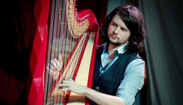 Benjamin Creighton Griffiths playing the harp, live music at Michelangelo Restaurant, Italian food