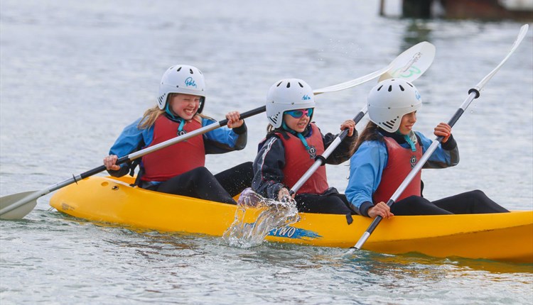 Children rowing in a canoe at UKSA, Easter fun day events, watersports, children activities, what's on, Cowes, Isle of Wight