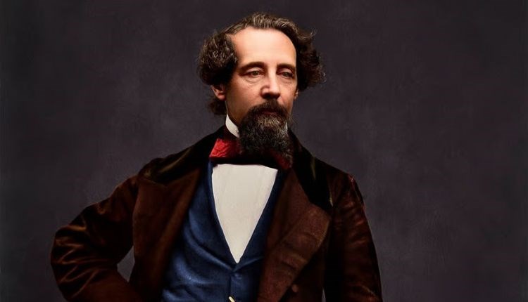 Charles Dickens standing by a desk, Dickens House Party Weekend at The Royal Hotel, Ventnor, Isle of Wight, event, what's on