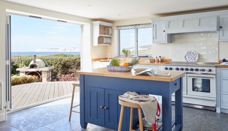 Kitchen at Flackstead with doors leading out to the patio with sea views, Wight Locations property, Isle of Wight, self catering, cottages and houses,