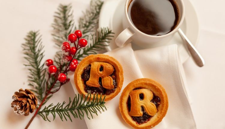 Mince pies, coffee and Christmas tree branch with red berries on a white cloth, Twixmas stay, hotel, Christmas event, what's on