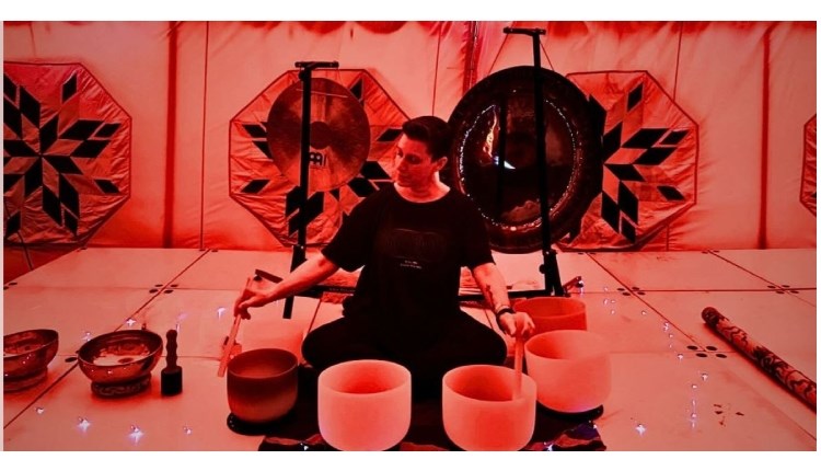 Isle of Wight, things to do, ventnor fringe, sound bath, man sitting in front of sound bowls