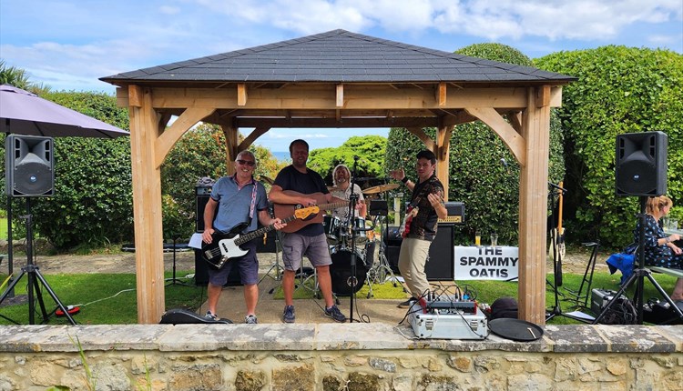 The Spammy Oatis performing in the garden at Luccombe Hall Hotel, Shanklin, Isle of Wight, live music, performance