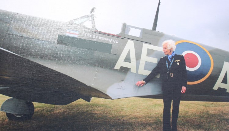 Mary Ellis standing next to a Spitfire, Isle of Wight aviation history at Wight Aviation Museum, island life at Quarr Abbey, event, what's on