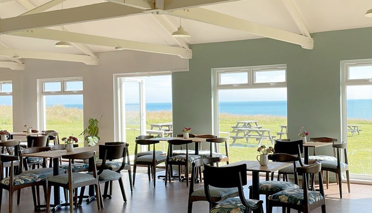 Table and chairs inside the cafe at Isle of Wight Pearl, food and drink, shopping