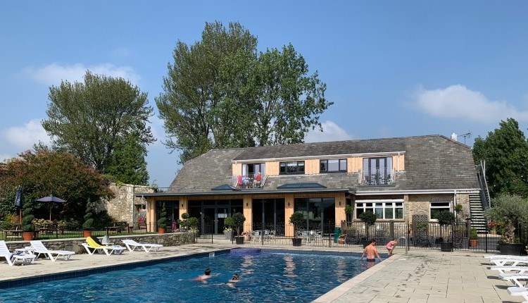 Outside view of The Core Complex overlooking the swimming pool at Appuldurcombe Gardens Holiday Park, Isle of Wight