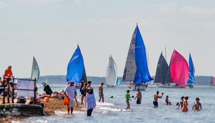 People swimming in the sea watching the boats sailing, Cowes Week, event, what's on