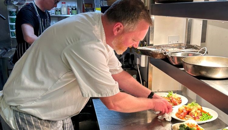 Chef serving food at The Woodmans Arms, Wootton, Isle of Wight, country pub, local produce, food & drink