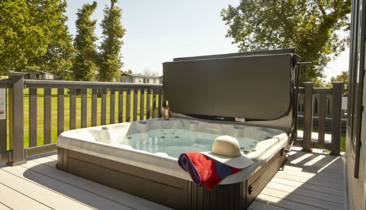 Hot tub on balcony of lodge at St Helens Holiday Resort, Isle of Wight, Self Catering