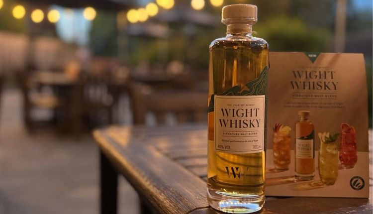 Bottle of Wight Whiskey on an outdoor dining table, New Inn, music event, Shalfleet, Isle of Wight, what's on