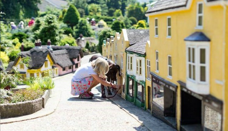 Child viewing the Old Shanklin Village miniature at the Model Village Godshill, Isle of Wight, Things to Do