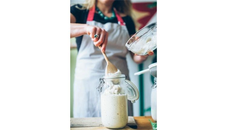 Lady putting sourdough in glass jar, workshops at the Garlic Farm, Isle of Wight, food event, what's on