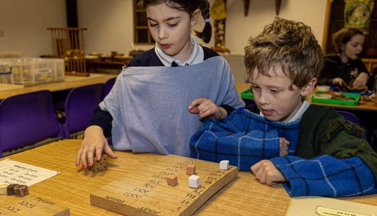Visit Isle of Wight, Things to do, Children playing roman board games in dress-up