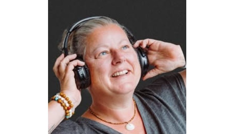 Visit Isle of Wight, Things to do, Person enjoying listening to headphones