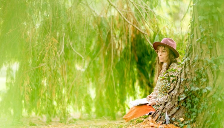 Visit Isle of Wight, Things to do, person sitting by a tree
