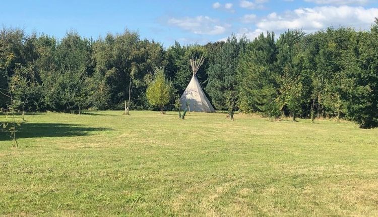 Outside view of a tipi, Isle of Wight Tipi Holidays, glamping, luxury, camping