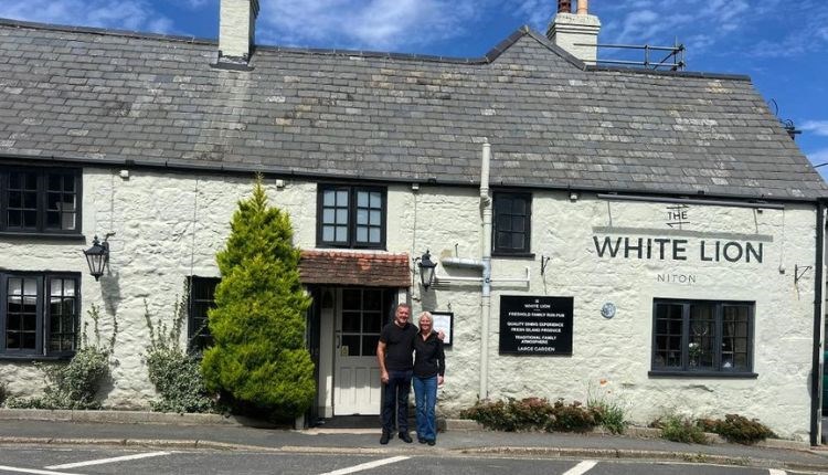 Managers of White Niton pub standing outside, Niton, Isle of Wight, eat & drink