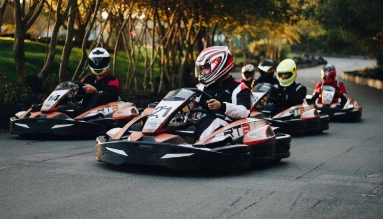 Group of people racing in karts on the track at Wight Karting, activities, attraction, Isle of Wight