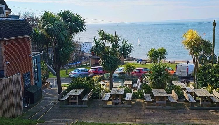 Sea view from outdoor eating area at The Woodvale, Gurnard, Isle of Wight, food and drink