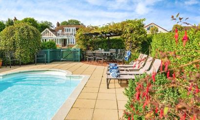 Outside pool with loungers, Island Holiday Homes, self catering, Isle of Wight