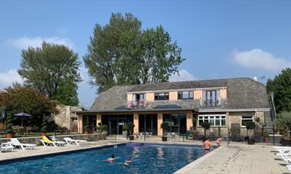 Outside view of The Core Complex overlooking the swimming pool at Appuldurcombe Gardens Holiday Park, Isle of Wight