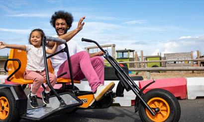 Father and daughter on the go karts at Tapnell Farm Park, Isle of Wight, attraction, family fun, activities