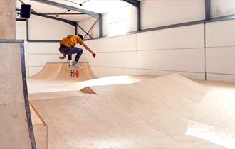 Man skating at Canopy Skatepark, Chale, Things to Do, activities