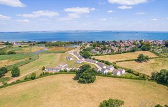 Isle of Wight, Accommodation, Seaview Holidays, image showing aerial view of Holiday cottages and views to sea.