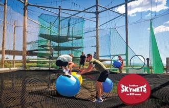 Boy and adult playing on Skynets at Sandham Gardens, Sandown, Things to Do