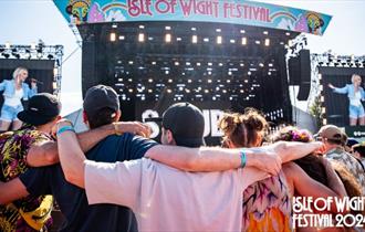 Crowds of people watching an act on the main stage at the Isle of Wight Festival, music, what's on, event