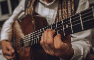 Man playing a guitar, Sunday Jazz event at The Garlic Farm Restaurant, food & drink, what's on, Isle of Wight