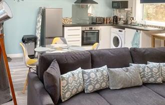 Open plan living area and kitchen at self catering cottage at The Wighthill, Sandown