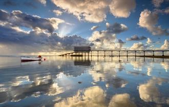 Clouds reflecting on the sea next to Bembridge lifeboat station, Bembridge Lane End Beach, Isle of Wight, Things to Do