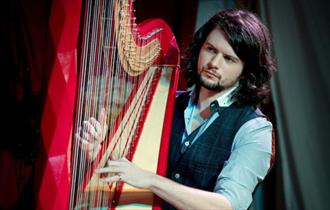 Benjamin Creighton Griffiths playing the harp, live music at Michelangelo Restaurant, Italian food
