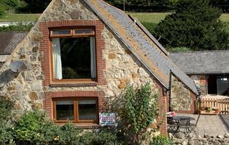 Isle of Wight, Accommodation, Brummell Barn, Image showing stone facade of barn.
