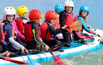 Children on large paddleboard, UKSA event, children's activities, Easter event, what's on, Cowes, Isle of Wight