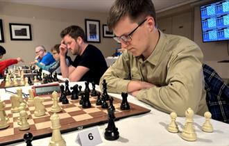 David Collyer playing in the 2024 Isle of Wight Blitz, Isle of Wight International Chess Tournament, Ryde - image credit: David Lightfoot