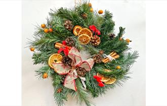 Family showing the crafts they've made at a craft workshop at Island CraftWorks, Ryde, Isle of Wight, family, Christmas Wreath, workshops