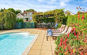 Outside pool with loungers, Island Holiday Homes, self catering, Isle of Wight