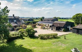 Aerial view of Middle Barn Farm with rolling countryside, self-catering, Isle of Wight